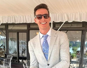 Ben Saperia, founder of Faded Days Sunglasses, smiling outdoors wearing affordable polaized sunglasses.