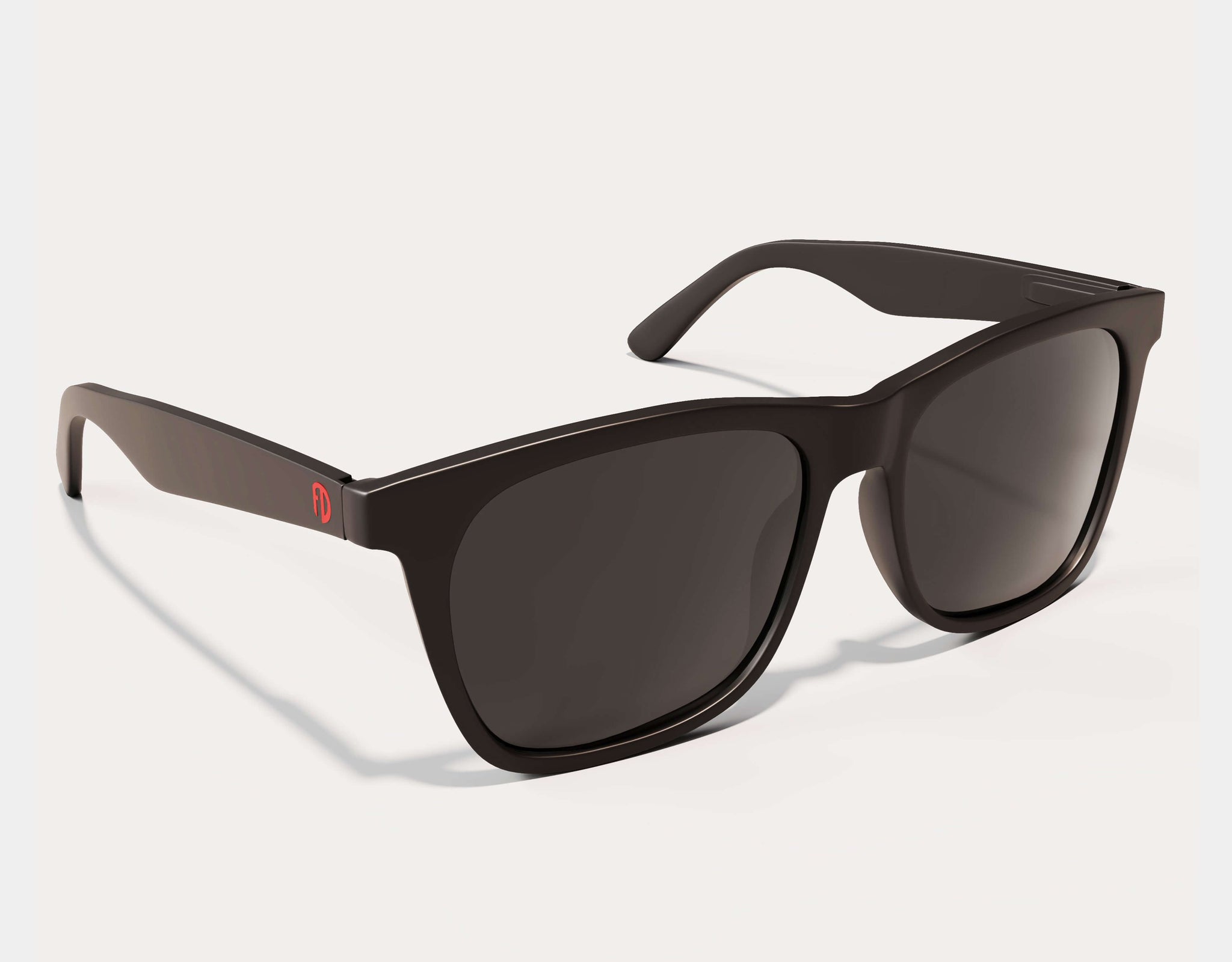 Black sunglasses with dark lenses on a white background