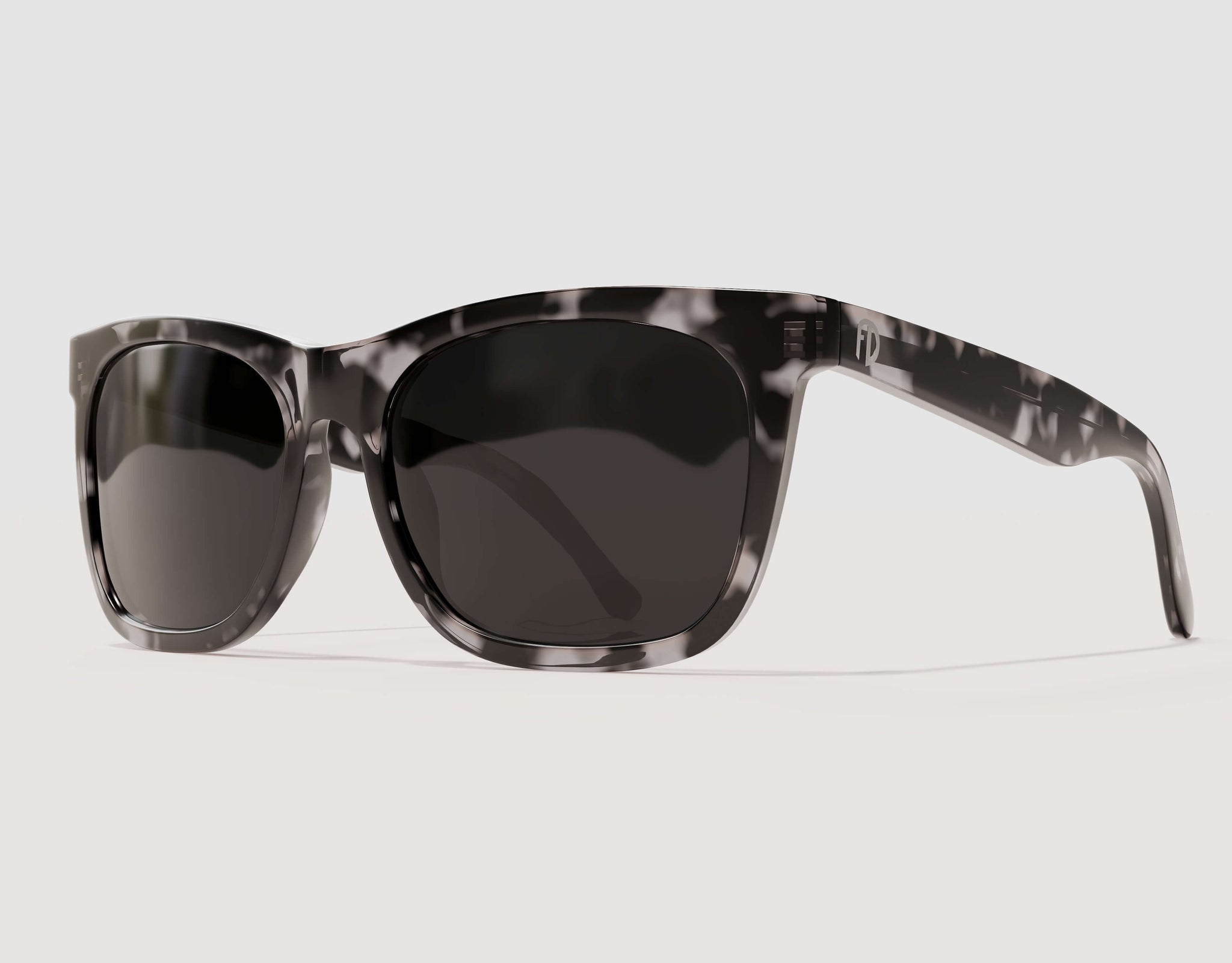 XXL Robust cow black big head sunglasses featuring a high-contrast black-and-white pattern, angled view.